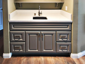Image Title Anaheim Gray (Kitchen Cabinet), vanity with metallic handles.