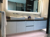 Bathroom Custom vanity - Glossy White cabinet, Greyish top, and white acrylic sink 