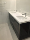 Bathroom vanity - dark grey cabinet, metallic handles and white acrylic top